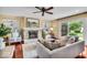 Comfortable living room with a stone fireplace and access to the backyard patio at 7316 Lesley Ave, Indianapolis, IN 46250