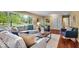 Inviting living room with large windows, a comfortable couch, and stylish decor at 7316 Lesley Ave, Indianapolis, IN 46250