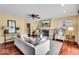 Inviting living area with a stone fireplace, built-in shelves, and hardwood floors at 7316 Lesley Ave, Indianapolis, IN 46250