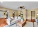 Cozy living room features a comfortable sofa, ceiling fan, and hardwood floors at 7316 Lesley Ave, Indianapolis, IN 46250