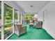 Relaxing screened porch with outdoor seating and views of the backyard at 7316 Lesley Ave, Indianapolis, IN 46250