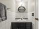 Cozy bathroom with vanity, mirror, classic tiles, and towel rack at 7334 Country Brook Dr, Indianapolis, IN 46260