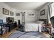 Comfortable bedroom featuring hardwood floors, a cozy bed, and bright natural light at 7334 Country Brook Dr, Indianapolis, IN 46260