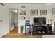 Bedroom with a view to the hallway and stairs, featuring a television and a record player at 7334 Country Brook Dr, Indianapolis, IN 46260