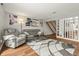 Inviting living room featuring a comfortable gray sofa, recliner, and stylish patterned rug at 7334 Country Brook Dr, Indianapolis, IN 46260
