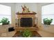 Charming stone fireplace with decorative accents, creating a cozy focal point in the room at 7737 Wolfgang Pl, Indianapolis, IN 46239