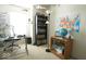 Bright office with a world map, modern desk, and a bookcase filled with books at 7737 Wolfgang Pl, Indianapolis, IN 46239