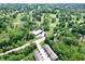 Aerial view of the community featuring tree-lined streets, a golf course, and well-maintained homes at 8317 Pine Branch Ln, Indianapolis, IN 46234