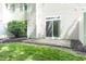 Backyard features a stone patio, a grassy area, and mature landscaping at 8317 Pine Branch Ln, Indianapolis, IN 46234