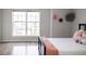 Bright bedroom featuring wood floors, and decorative flowers on the wall at 8317 Pine Branch Ln, Indianapolis, IN 46234
