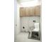 Laundry room featuring tile floors, cabinets and a small chair at 8317 Pine Branch Ln, Indianapolis, IN 46234