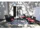View of the rear patio with outdoor seating, a decorative rug, and a sliding glass door entrance at 8317 Pine Branch Ln, Indianapolis, IN 46234