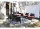 Outdoor patio featuring modern black wicker furniture with bright cushions, perfect for relaxation and entertaining at 8317 Pine Branch Ln, Indianapolis, IN 46234