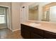 Bright bathroom with a shower-tub combo, toilet, and a vanity with a sink and mirror at 8354 Fieldfare Way, Indianapolis, IN 46237