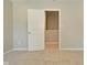 Neutral bedroom featuring plush carpeting and a white door with a view into a closet at 8354 Fieldfare Way, Indianapolis, IN 46237