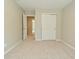 Neutral bedroom featuring plush carpeting and a double doored closet at 8354 Fieldfare Way, Indianapolis, IN 46237