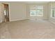 Spacious bedroom featuring plush carpeting and two windows with blinds at 8354 Fieldfare Way, Indianapolis, IN 46237