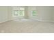Bright bedroom featuring plush carpeting and two windows with blinds at 8354 Fieldfare Way, Indianapolis, IN 46237