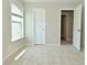 A bedroom features neutral carpeting, one window and two doors at 8354 Fieldfare Way, Indianapolis, IN 46237