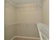 Spacious walk-in closet featuring built-in wire shelving, perfect for organization at 8354 Fieldfare Way, Indianapolis, IN 46237