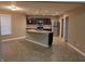 Spacious kitchen with stainless steel appliances, a center island with a sink, and tile flooring at 8354 Fieldfare Way, Indianapolis, IN 46237