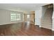Bright living room with wood-look floors and view to an open kitchen at 8354 Fieldfare Way, Indianapolis, IN 46237