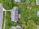 Aerial shot of backyard with deck, mature trees, and a fenced perimeter, offering privacy and outdoor living space at 8430 Harrison Pkwy, Fishers, IN 46038