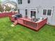 Spacious backyard with a red-railed deck featuring outdoor furniture, ideal for relaxing and entertaining at 8430 Harrison Pkwy, Fishers, IN 46038