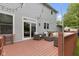 Backyard deck features outdoor seating with string lights, and a sliding glass door at 8430 Harrison Pkwy, Fishers, IN 46038