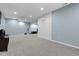 Finished basement area featuring light blue walls and neutral carpeting at 8430 Harrison Pkwy, Fishers, IN 46038