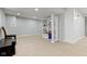 Finished basement features neutral carpet, recessed lighting, and a built-in bookshelf for ample storage space at 8430 Harrison Pkwy, Fishers, IN 46038
