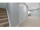Finished basement area featuring carpeted stairs and a spacious storage closet with double doors at 8430 Harrison Pkwy, Fishers, IN 46038