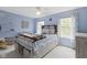 Cozy bedroom featuring a bed, built-in desk, and bright natural light at 8430 Harrison Pkwy, Fishers, IN 46038