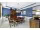 Classic dining room with traditional wood furniture, elegant lighting, and blue accent wall at 8430 Harrison Pkwy, Fishers, IN 46038