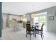 Open concept kitchen and dining area with stainless steel appliances at 8430 Harrison Pkwy, Fishers, IN 46038