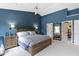 Spacious main bedroom with adjoining bathroom, walk-in closet, and neutral carpet at 8430 Harrison Pkwy, Fishers, IN 46038