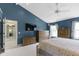 Large main bedroom with neutral carpet, and a view of the en-suite bathroom at 8430 Harrison Pkwy, Fishers, IN 46038
