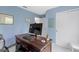 Home office with wooden desk, comfortable chair, and bright natural light at 8430 Harrison Pkwy, Fishers, IN 46038