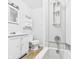 Well-lit bathroom with a tub-shower combo, vanity and ceramic tile flooring at 903 W 22Nd St, Anderson, IN 46016