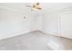 Bedroom featuring neutral walls, plush carpet, ceiling fan, and a closet at 903 W 22Nd St, Anderson, IN 46016