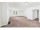 Spacious living room with neutral walls, carpet, textured ceilings and large windows at 903 W 22Nd St, Anderson, IN 46016