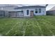 Spacious backyard featuring a wooden deck and ample green space, perfect for outdoor activities at 9145 Blue Pine Dr, Indianapolis, IN 46231