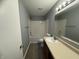 Clean, functional bathroom featuring a vanity, tub-shower combo and white tile at 9145 Blue Pine Dr, Indianapolis, IN 46231
