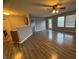 Open-concept living room with hardwood floors, neutral paint and ample natural light and ceiling fan at 9145 Blue Pine Dr, Indianapolis, IN 46231