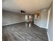 Large living room with modern flooring and neutral paint, perfect for entertaining or relaxing, ceiling fan at 9145 Blue Pine Dr, Indianapolis, IN 46231