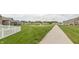 Community features a walkway and a charming green space with a pond at 9166 Lieven St, Avon, IN 46123