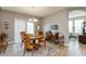 Open dining room features a wooden table with chairs, and sliding door to outdoor space at 9166 Lieven St, Avon, IN 46123