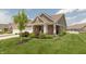 Charming single-story home with manicured lawn, covered porch, and inviting curb appeal at 9166 Lieven St, Avon, IN 46123