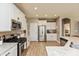 Bright kitchen showcases stainless appliances, white cabinets, and granite countertops at 9166 Lieven St, Avon, IN 46123