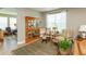 Cozy living room featuring decorative cabinet, large windows, and comfortable furniture at 9166 Lieven St, Avon, IN 46123
